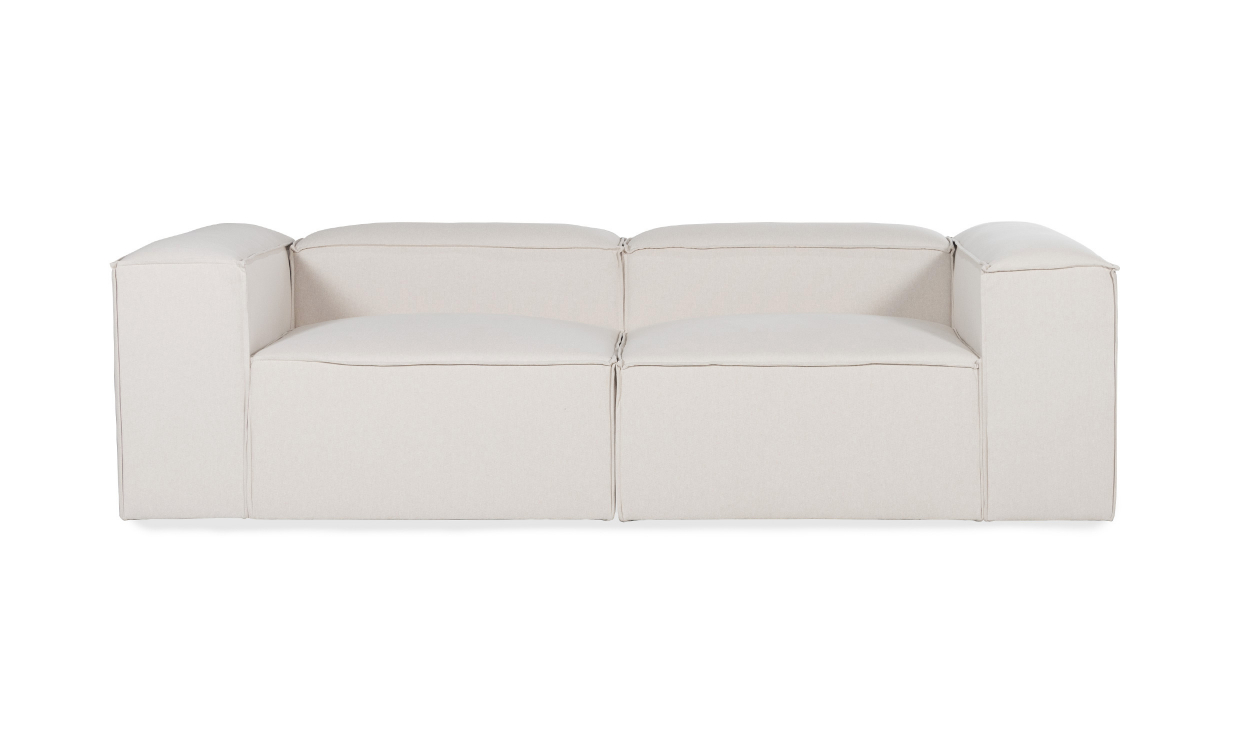 Sandbeige modulär soffa med mycket djup sits och låg rygg